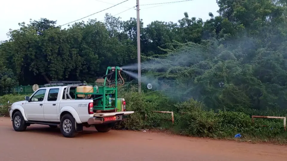 Health workers in Ouagadougou spraying mosquito repellent