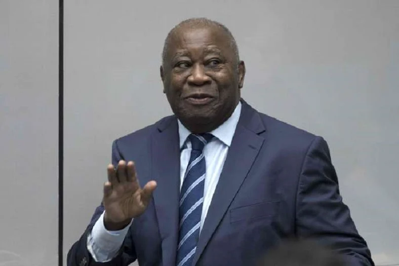 Laurent Gbagbo speaking at a podium
