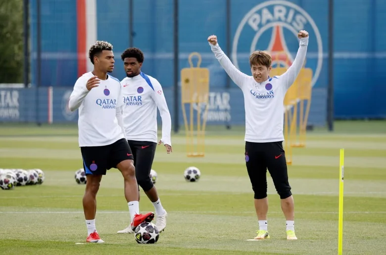 PSG squad celebrating their Champions League qualification