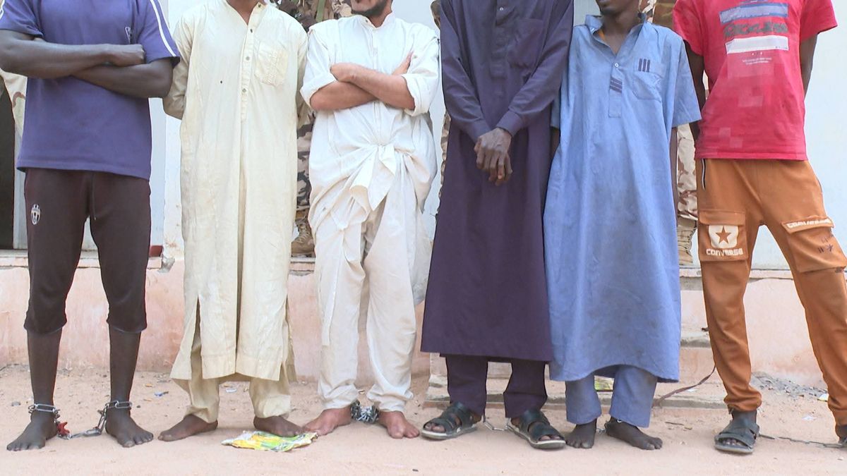Security personnel displaying seized weapons and drugs in Tibesti, Chad