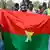 Supporters of the AES wave a homemade Burkina Faso flag (January 2024 archive)