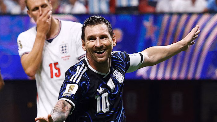 Lionel Messi celebrates after scoring against England