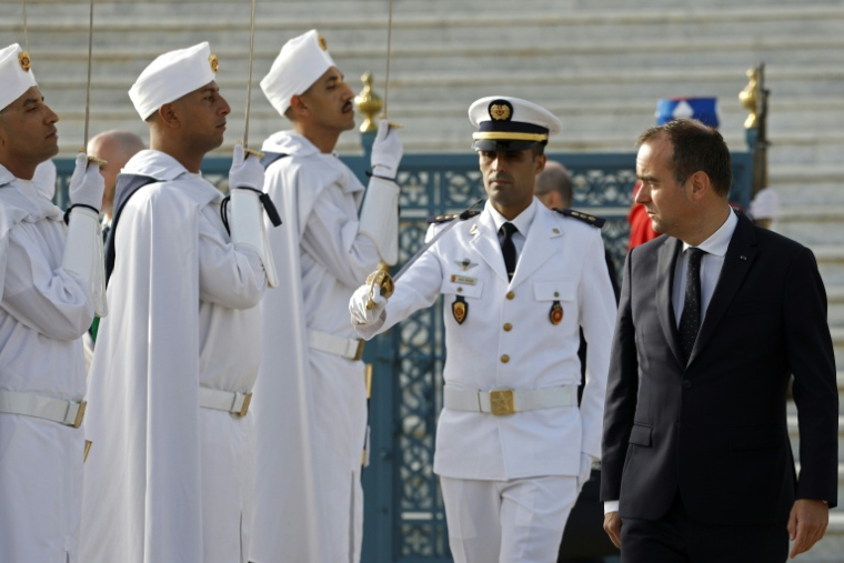 Sébastien Lecornu reviews a military honor guard at the Royal Mausoleum in Rabat
