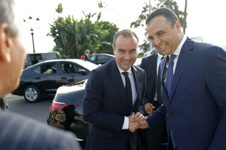 Sébastien Lecornu shakes hands with Moroccan government spokesperson Mustapha Baitas at the Royal Mausoleum