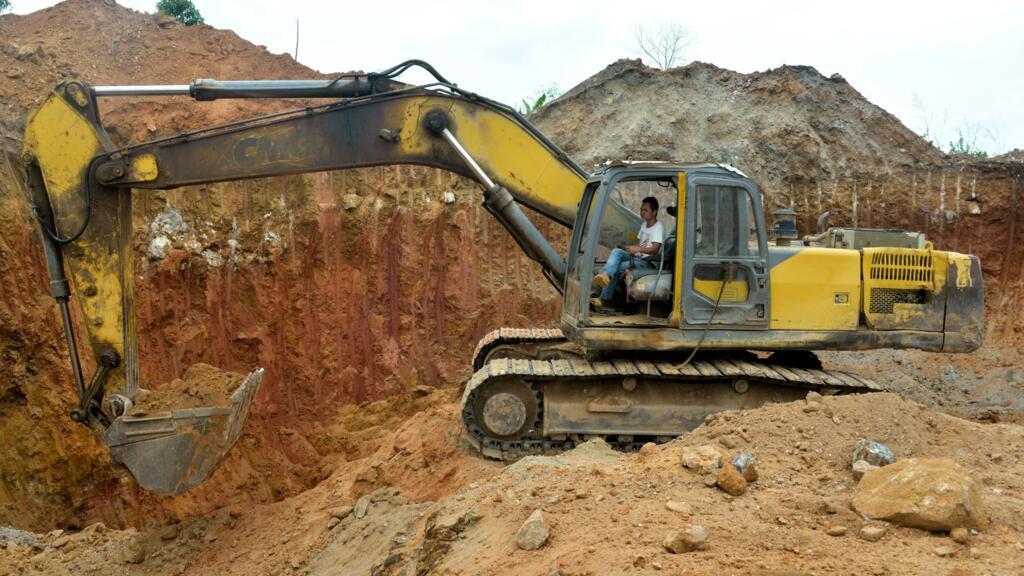 A bulldozer operated by a Chinese mining employee at a gold mining site near Betare Oya, Cameroon, April 4, 2018.