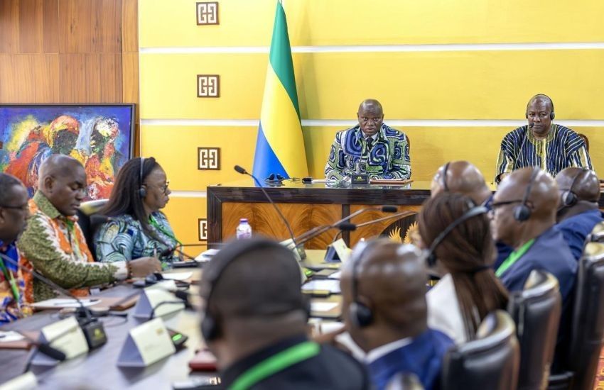 Diplomatic handshake between Gabonese and Ghanaian officials during bilateral agreements
