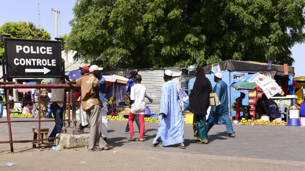 At Karang in Senegal, travelers pass through police checkpoints en route to Gambia, May 10, 2016.