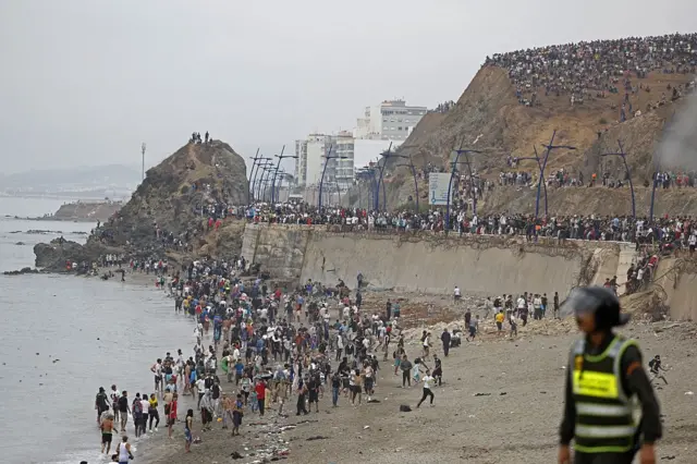 Migrants near the Morocco-Spain border attempting to cross into Ceuta