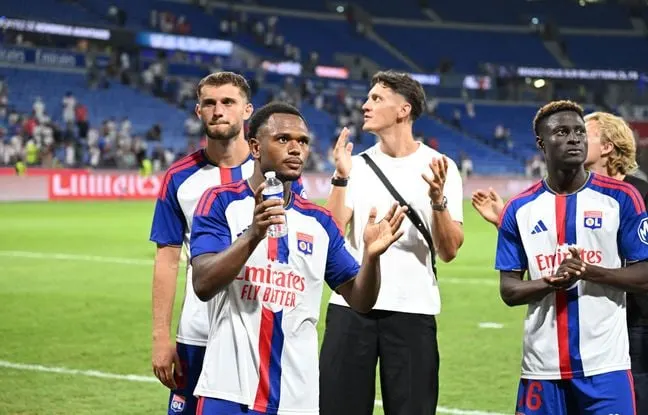 Olympique Lyonnais players in action during a Ligue 1 football match at Groupama Stadium